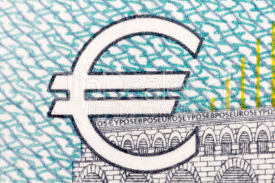 Euro symbol on blue - grey background.