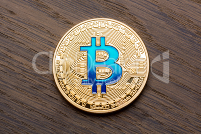 Red background with golden blue bitcoin.