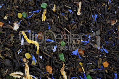 A large sheet of green tea, cornflower petals, sunflower petals,
