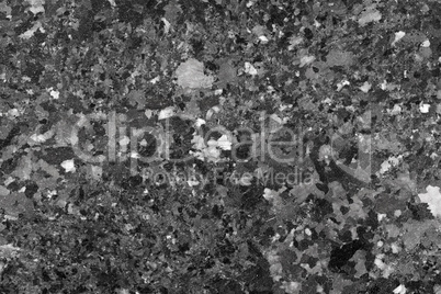 Abstract background of black granite texture.