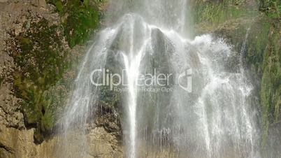 Summer Waterfall Close Up in Sunlight. Slow Motion