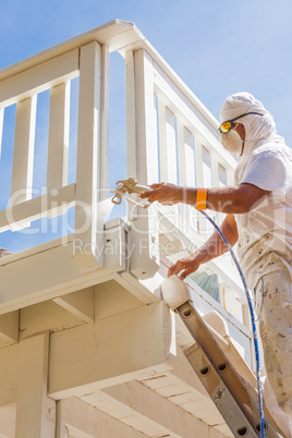 Professional House Painter Wearing Facial Protection Spray Paint