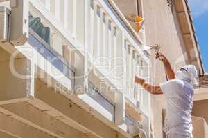Professional House Painter Wearing Facial Protection Spray Paint