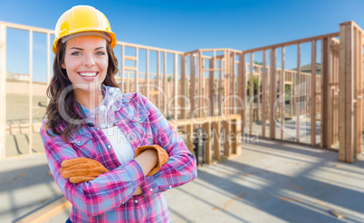 Young Attractive Female Construction Worker Wearing Gloves, Hard