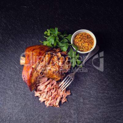 fresh roasted knuckle of pork with mustard