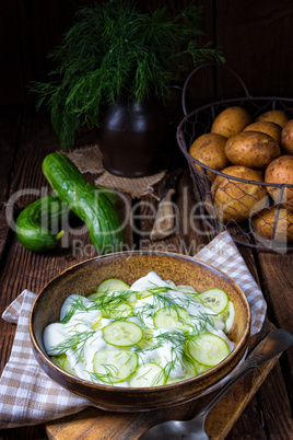 fresh cucumber salad with yogurt and young potatoes