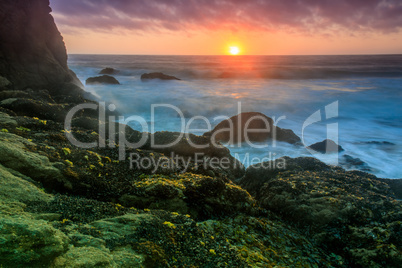 Sunset over Gray Whale Cove State Beach.