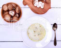 Mushroom soup in a white round plate
