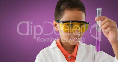 Boy scientist with test tube and purple background