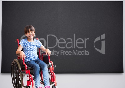 Disabled girl in wheelchair in front of blackboard