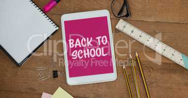 Tablet on a school table with back to school on screen