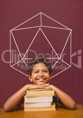 Student boy at table against red blackboard with school and education graphic