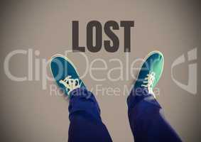 Lost text and Green shoes on feet with brown background