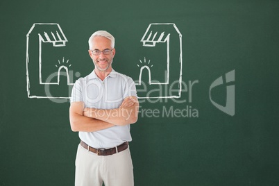 Happy student man with fists graphic standing against green blackboard
