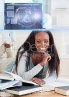 Female Student studying with book and science education interface graphics overlay