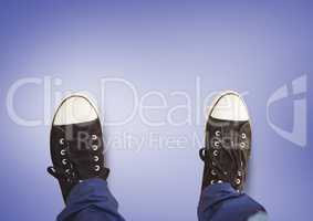 Black shoes on feet with purple background