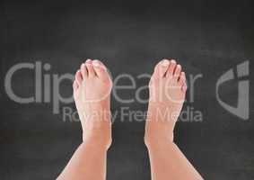 Bare feet and grey stone background