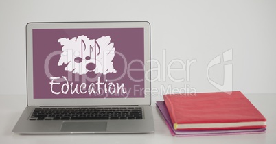 Computer on a school table with school icon on screen