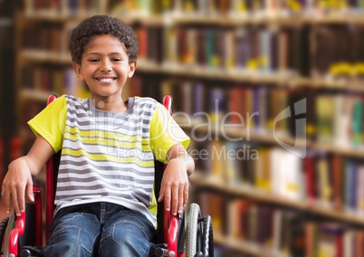 Disabled boy in wheelchair in school library