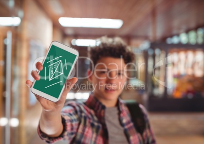 Boy holding a phone with school icons on screen