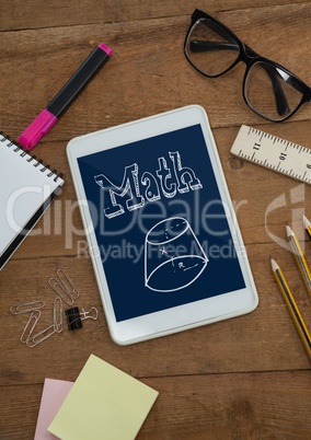 Tablet on a school table with school icons on screen