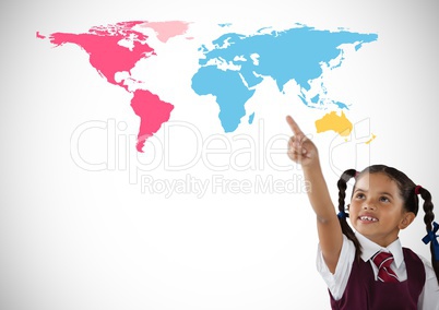 Schoolgirl pointing in front of colorful world map