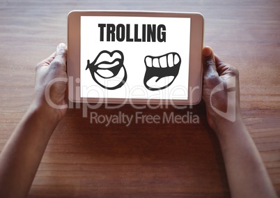 Trolling text and mouth cartoons on tablet in hands