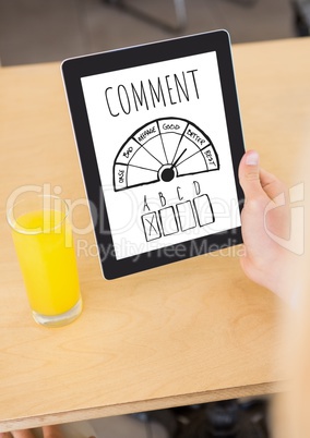 Comment text and survey graphic on tablet screen with hands