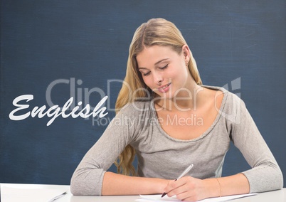 Student girl at table against blue blackboard with English text