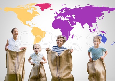 Kids in sack race in front of colorful world map