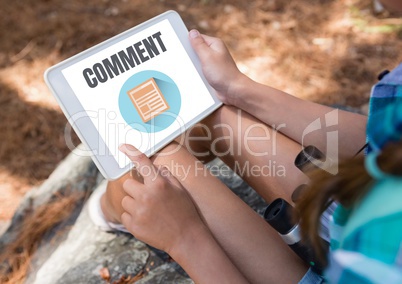 Comment text and graphic on tablet screen with womans hands