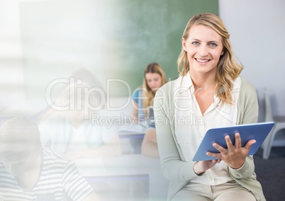 teacher with class and tablet