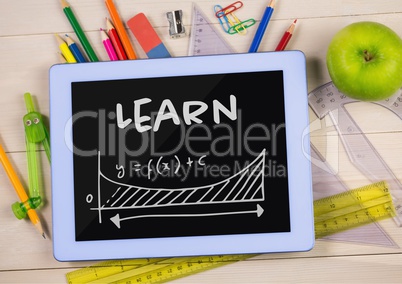 Tablet on a school table with school icons on screen