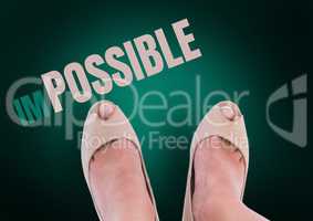 Impossible text and Beige shoes on feet with green background
