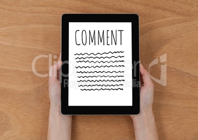 Comment text and graphic on tablet screen with hands