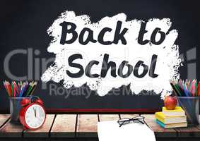 Desk foreground with blackboard graphics of Back to school