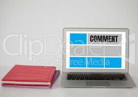Comment text and graphic on laptop screen with book