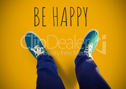 Be happy text and Blue shoes on feet with yellow background