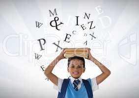 Many letters around Schoolboy holding books on head with bright background