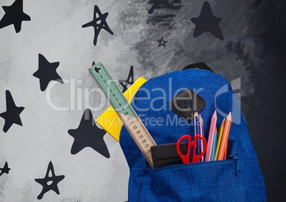 Schoolbag on Desk foreground with blackboard graphics of stars