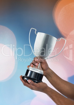 Man with a trophy on hands