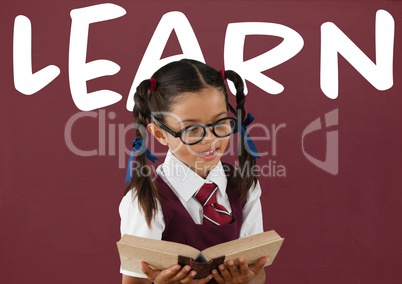 Student girl at table against red blackboard with learn text