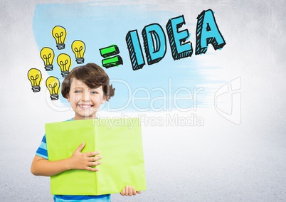 Boy holding book in front of colorful light bulbs idea graphics