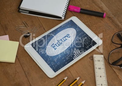 Tablet on a school table with school icons on screen