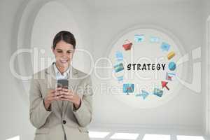 Business woman using a phone in a 3D room with a conceptual graphic on the wall