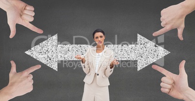 Hands pointing at confused business woman against grey background with arrows