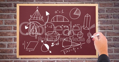 Hand drawing diagrams on blackboard