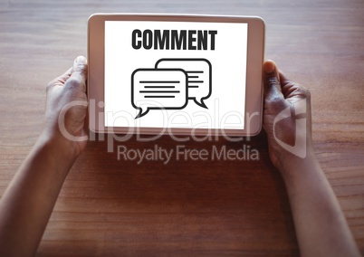 Comment text and chat graphic on tablet screen with hands