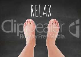 Relax text and Bare feet and grey stone background