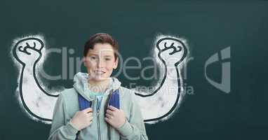 Student boy with fists graphic standing against green blackboard
